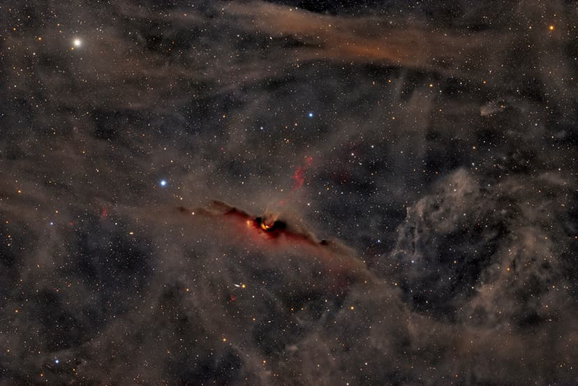 The Red Glow of the Cosmic Bat Nebula image
