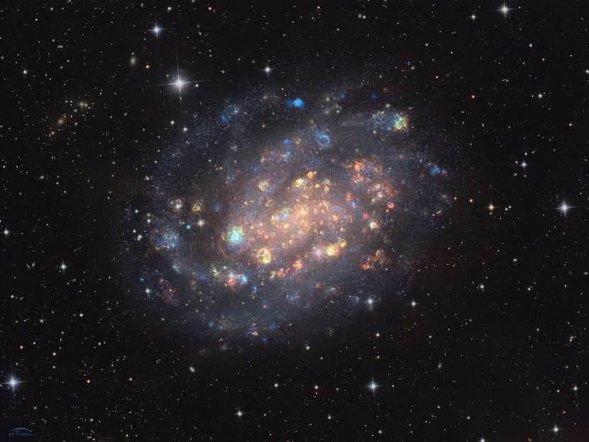 NGC 300: A Cosmic Gemstone with Stars and Gas Clouds image